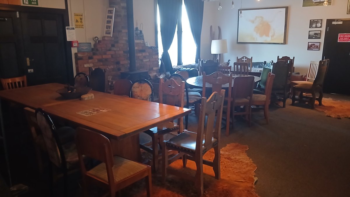 Wood burner and brick chimney in the Black Dog Tavern dining room