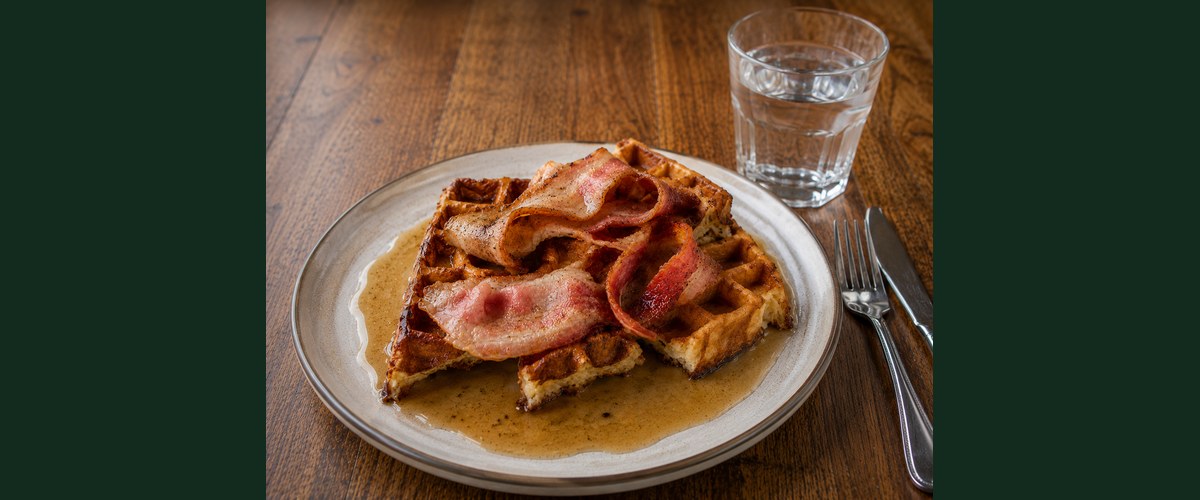 Don Luciano bacon and waffles with maple syrup
