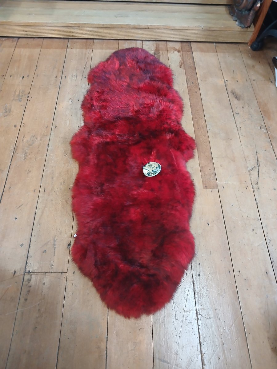 Red dyed sheepskin rug