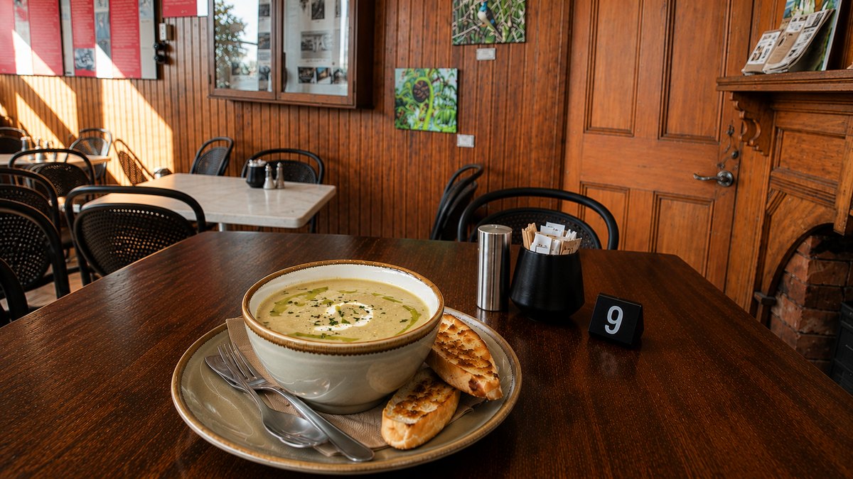 Homemade soup with grilled ciabatta on a table at Cafe Norsewood