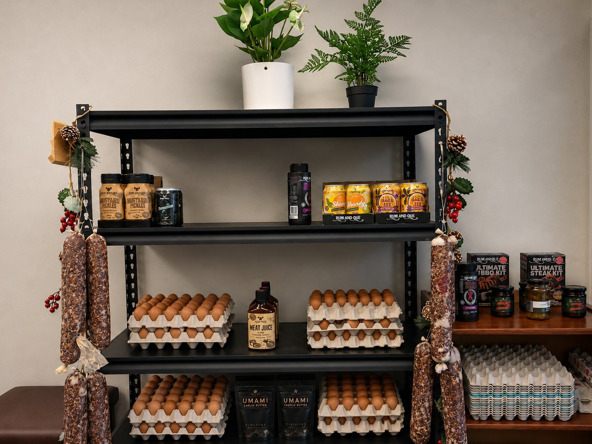Salamis hanging beside local egg trays at Scotty's Meats